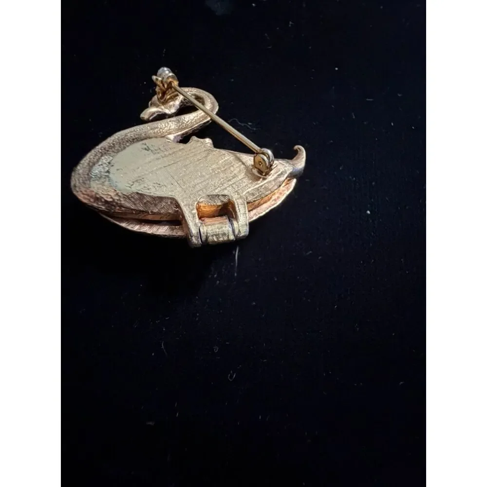 vtg.  Gold toned Swan Brooch/locket with Green Rhinestone eyes and opens up to